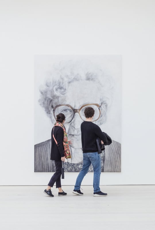 visitors looking at
          artwork