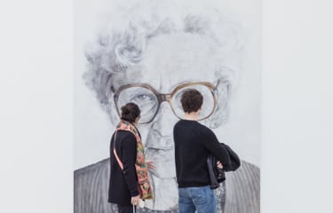 visitors looking at
          artwork