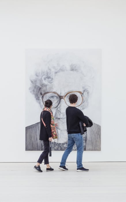 visitors looking at
          artwork